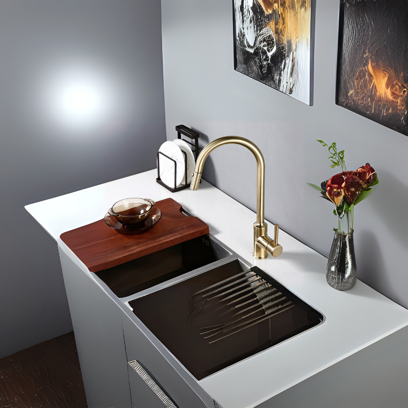 Modern kitchen sink from Grella Boutique with gold faucet, cutting board, and decorative vase.